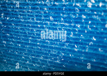Transparent blue plastic bubble wrap for packaging shipping and transport security protection Stock Photo