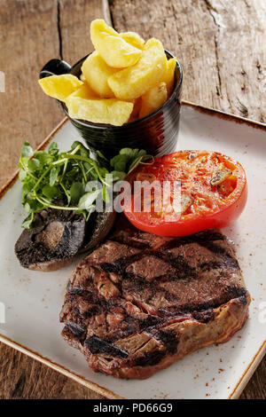 plated ribeye steak dinner Stock Photo - Alamy