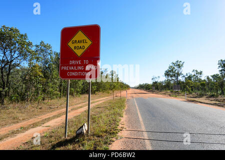 Road sign warning of a gravel road, Peninsula Development Road (PDR), Cape York Peninsula, Far North Queensland, FNQ, QLD, Australia Stock Photo