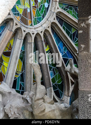 Barcelona, Spain - May 9, 2018: Exterior element - stained glass window - of the Sagrada Familia, large unfinished Roman Catholic church in Barcelona, Stock Photo