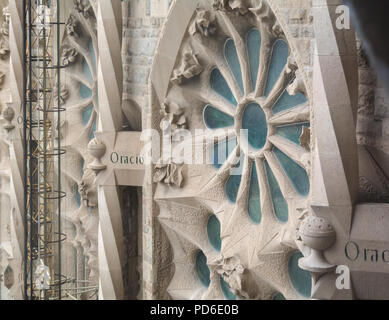 Barcelona, Spain - May 9, 2018: Exterior element - stained glass window - of the Sagrada Familia, large unfinished Roman Catholic church in Barcelona, Stock Photo
