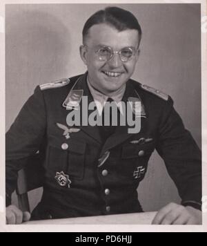 Image from the photo album of Oberleutnant Oscar Müller of  Kampfgeschwader 1: Oberleutnant Hans Sumpf in his office at Dno Airfield in Russia in 1942. Sumpf was Staffelkapitän of 5./KG1 from 7th October 1941 until his death on 26th March 1942. He was posthumously awarded the Ritterkreuz (Knight's Cross of the Iron Cross) on 20th August 1942. Stock Photo
