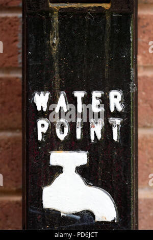 Water Point Sign with white paint text and tap faucet on black ...