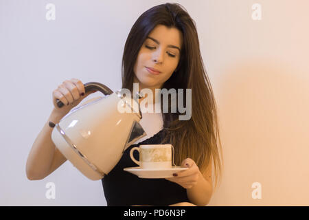 Beautiful and elegant woman drinking tea. Stock Photo