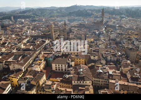 Bargello Museum (L) and the Palazzo Vecchio (R) rising over the tiled roofs of the Florence downtown pictured from the dome of the Florence Cathedral (Duomo di Firenze) in Florence, Tuscany, Italy. Stock Photo