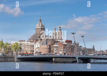 Amsterdam, Netherlands -April 04, 2018 -Amsterdam historic skyline with 19th century Basilica of St. Nicholas, historic neo baroque catholic church Stock Photo