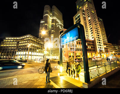 Night life people coming out of U-Bahn Zoologischer Garten near Gedächtniskirche, City West, Berlin, Germany Stock Photo