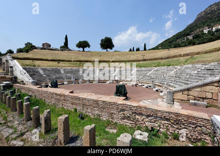 View of the ancient theatre which has the cavea is carved into the hillside and dates from around the 3rd century BC. Ancient Messene. Peloponnese. Gr Stock Photo