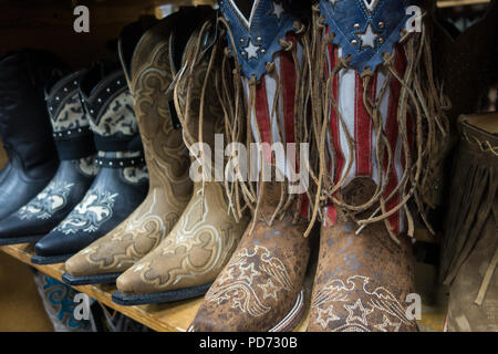 Rows of cowboy boots for sale in a boot shop in Nashville, TN, USA Stock Photo