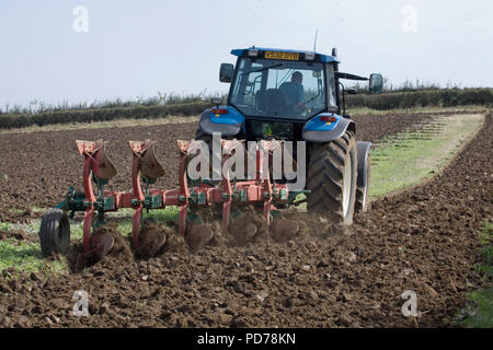 New Holland 8360 tractor Ploughing Stock Photo