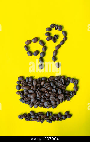 top view flat layer coffee beans in cup and smell icon shape on yellow background Stock Photo