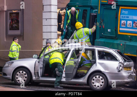 Glasgow bin lorry crash. Fire and paramedic crews attend to the injured at the scene of the horrific incident in Glasgow.  22 December 2014 Stock Photo