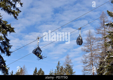 Ski lift chairs on bright winter day Stock Photo