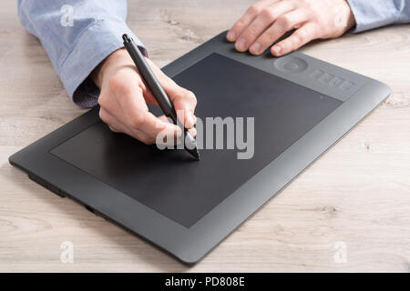 Man using modern graphical tablet Stock Photo