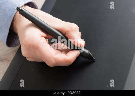 Man using modern graphical tablet Stock Photo