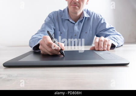 Man using modern graphical tablet Stock Photo