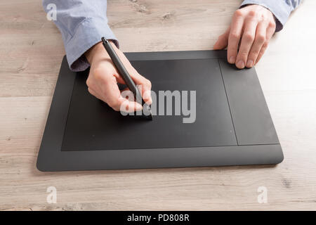 Man using modern graphical tablet Stock Photo
