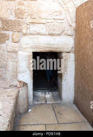 The Door of Humility, entrance to the Church of the Nativity, Bethlehem.  Made small by the Crusaders  to prevent people entering on horseback. Stock Photo