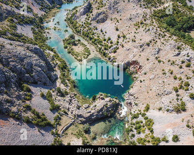 Zrmanja River in northern Dalmatia, Croatia is famous for its crystal clear waters and countless waterfalls surrounded by a deep canyon. Stock Photo