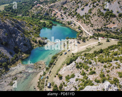 Zrmanja River in northern Dalmatia, Croatia is famous for its crystal clear waters and countless waterfalls surrounded by a deep canyon. Stock Photo