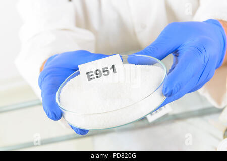 Researcher presenting preservatives substances that are added to products such as foods, pharmaceuticals, paints, biological samples, wood etc. Stock Photo