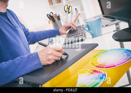 Designer using graphics tablet in the office Stock Photo