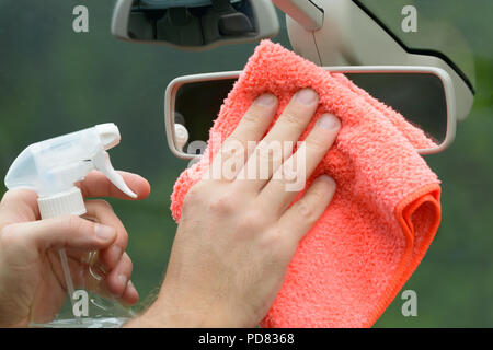 Hand with cloth cleaning car interior Stock Photo