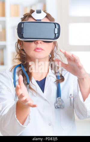 Medical doctor using virtual reality headset at the consulting room Stock Photo