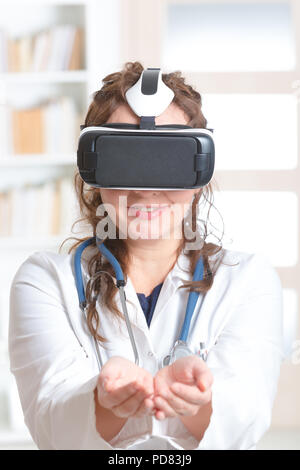 Medical doctor using virtual reality headset at the consulting room Stock Photo