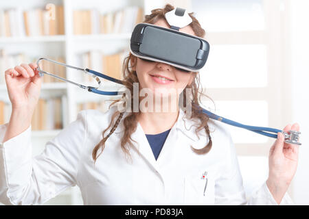 Medical doctor using virtual reality headset at the consulting room Stock Photo