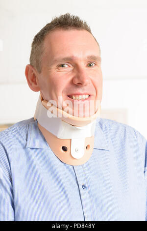 Man with a surgical cervical collar suffering from neck pain Stock Photo