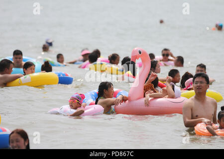 Qingdao, Qingdao, China. 7th Aug, 2018. Qingdao, CHINA-Tourists flock to the beach during summer vacation in Qingdao, east China's Shandong Province. Credit: SIPA Asia/ZUMA Wire/Alamy Live News Stock Photo