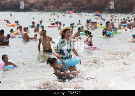 Qingdao, Qingdao, China. 7th Aug, 2018. Qingdao, CHINA-Tourists flock to the beach during summer vacation in Qingdao, east China's Shandong Province. Credit: SIPA Asia/ZUMA Wire/Alamy Live News Stock Photo