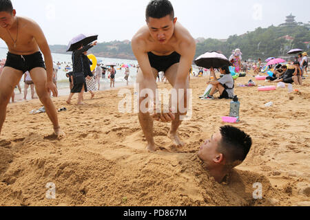 Qingdao, Qingdao, China. 7th Aug, 2018. Qingdao, CHINA-Tourists flock to the beach during summer vacation in Qingdao, east China's Shandong Province. Credit: SIPA Asia/ZUMA Wire/Alamy Live News Stock Photo