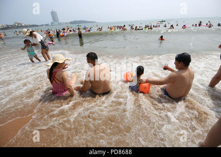 Qingdao, Qingdao, China. 7th Aug, 2018. Qingdao, CHINA-Tourists flock to the beach during summer vacation in Qingdao, east China's Shandong Province. Credit: SIPA Asia/ZUMA Wire/Alamy Live News Stock Photo