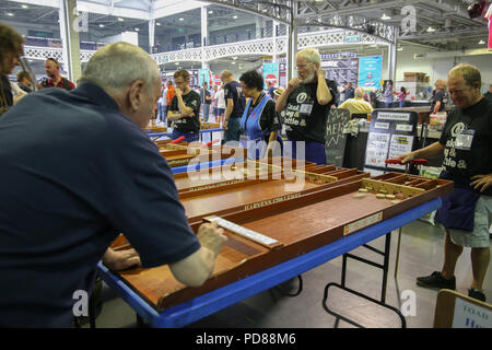 London UK 07 August 2018  for some one glass wasnt enough at the Great British Beer Festival held from today until the 11th of August at the London Olympia,traditional PUB games ,thousands of beers ciders ,stouts wines real ales,pale ales  and pub grup  to keep everybody happy @Paul Quezada-Neiman/Alamy Live News
