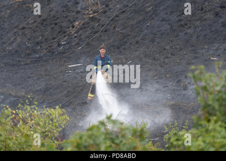 Stoke-on-Trent, UK. 7 August 2018 - Staffordshire Fire crews tackle blaze in Central Forest Park, Stoke-on-Trent. At it's height, three crews tackled a 80x30 metre fire. Credit: Benjamin Wareing/Alamy Live News Stock Photo