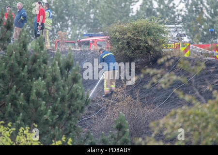 Stoke-on-Trent, UK. 7 August 2018 - Staffordshire Fire crews tackle blaze in Central Forest Park, Stoke-on-Trent. At it's height, three crews tackled a 80x30 metre fire. Credit: Benjamin Wareing/Alamy Live News Stock Photo