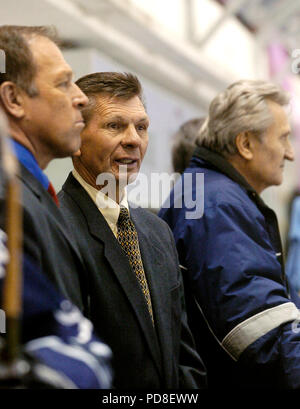 Bratislava, Slovakia. 04th Dec, 2004. ***FILE PHOTO*** Stan Mikita (center), legendary Slovak-born Canadian former ice hockey player for the Chicago Black Hawks of NHL, is seen during an exhibition ice hockey match on a bench in Bratislava, Slovakia, on December 4, 2004. On the left side is seen Vladimir Stastny and on the right side Jan Starsi. Credit: Samuel Kubani/CTK Photo/Alamy Live News Stock Photo