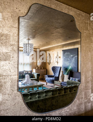 Reflection of gold living room in 1970s mirror Stock Photo
