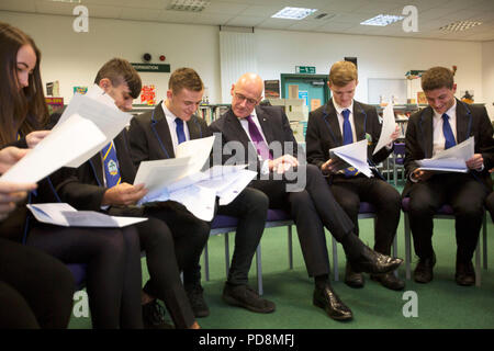 Deputy First Minister and Education Secretary John Swinney meeting pupils at Firrhill High School in Edinburgh as they get their exam results. Higher passes for pupils sitting Scottish exams have remained largely in line with last year, official figures show. Stock Photo