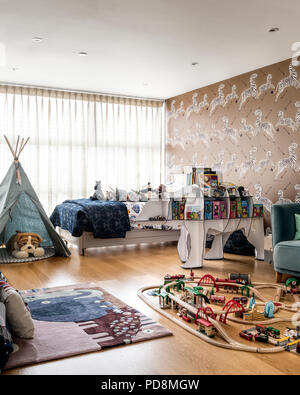 Boys room with wigwam and trainset Stock Photo