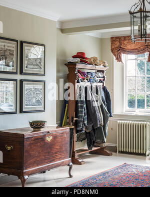 Coat stand and storage chest in entrance hallway Stock Photo