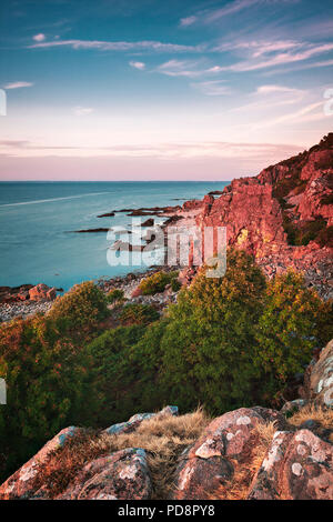 Sunset at cliff beach in Hovs Hallar, Sweden. Stock Photo