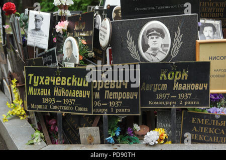 Communal grave of unclaimed ashes number one, where people executed by the NKVD were secretly buried from 1930 to 1942, at the Donskoye Cemetery in Moscow, Russia. It is believed the mass grave contains the remains of 4259 victims of Stalin's regime. The plaques with the names were installed by the relatives since the 1980s. The plaques devoted to Red Army commanders Mikhail Tukhachevsky, Ieronim Uborevich and August Kork executed in 1937 are seen in the picture in the foreground among others. Stock Photo
