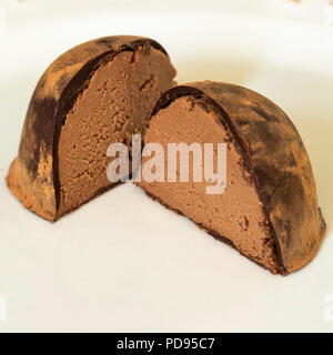 chocolate trufra cut in half brazilian bonbon on white background Stock Photo