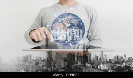 Double exposure, a man using on digital tablet and augmented reality technology. Element of this image are furnished by NASA Stock Photo