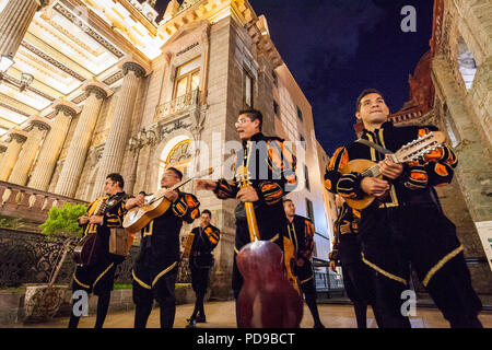 Troubadours entertain a crowd of tourists in Guanajuato, Mexico. Stock Photo