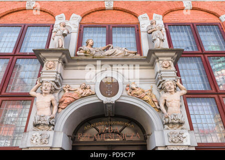 View of Baroque sculptures decorating the entrance to the Pomeranian Chamber Of Crafts building in Gdansk Old Town quarter, Pomerania, Poland. Stock Photo