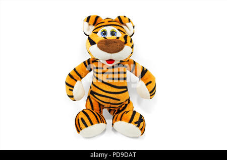 Children's soft toy tiger on a glossy sheet and white background Stock Photo